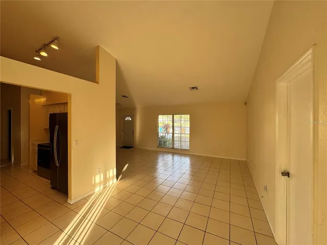 a view of a kitchen with natural light