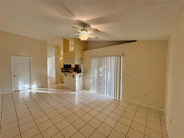 a view of a kitchen with a sink and a window