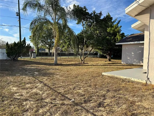 a house with palm trees in front of it