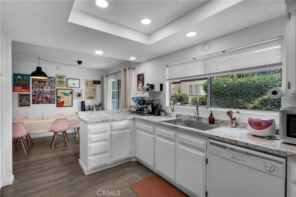 4424 San Jose Street, Unit 3 Montclair, CA 91763 - Photo 20 of 33 a kitchen with a sink and wooden floor