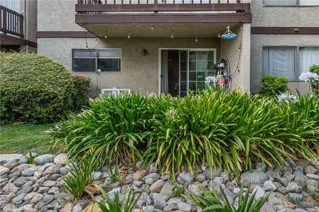 4424 San Jose Street, Unit 3 Montclair, CA 91763 - Photo 2 of 33 a view of a house with a flower garden