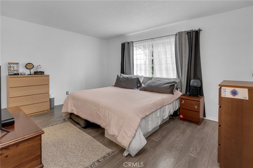 4424 San Jose Street, Unit 3 Montclair, CA 91763 - Photo 21 of 33 a bedroom with a bed and a window