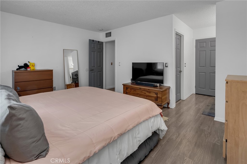 4424 San Jose Street, Unit 3 Montclair, CA 91763 - Photo 22 of 33 a bedroom with a bed and a flat screen tv