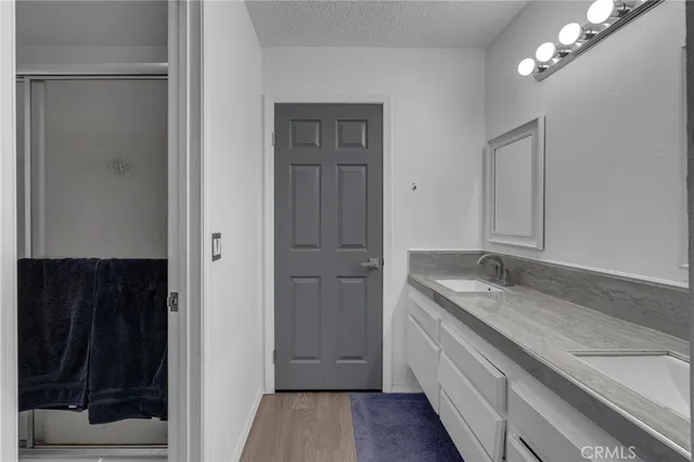 a white toilet sitting next to a shower