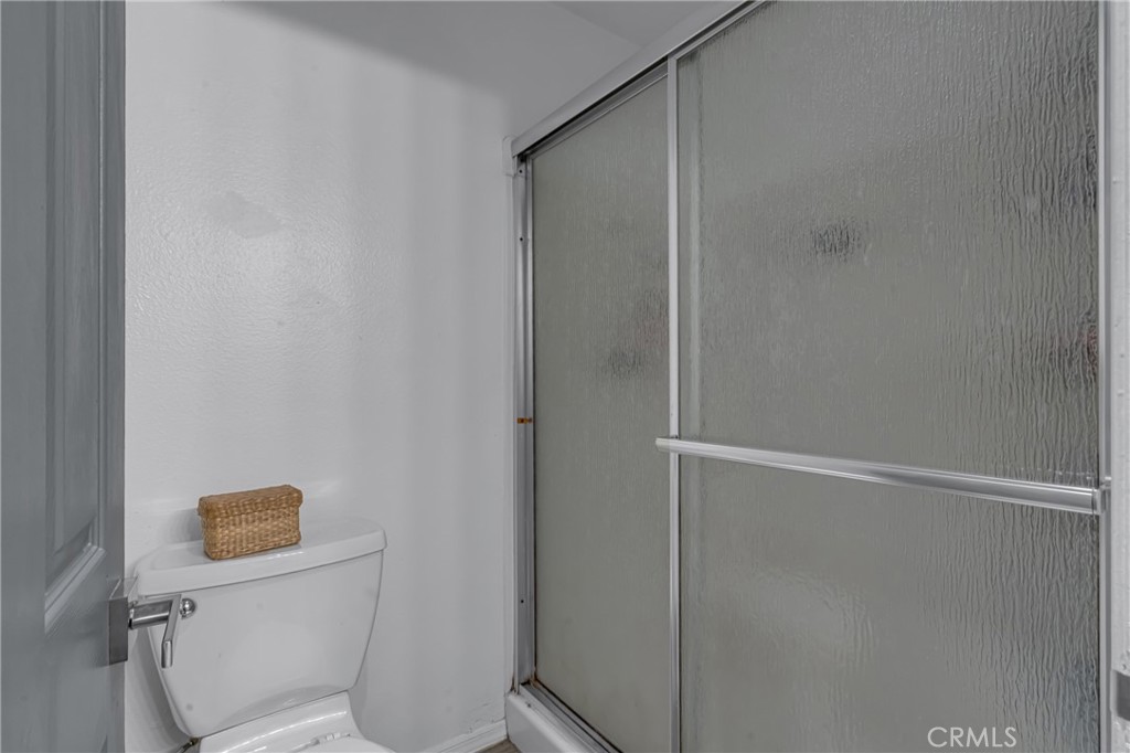 4424 San Jose Street, Unit 3 Montclair, CA 91763 - Photo 25 of 33 a white toilet sitting next to a shower