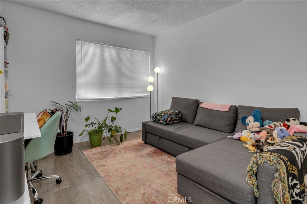 4424 San Jose Street, Unit 3 Montclair, CA 91763 - Photo 27 of 33 a living room with furniture and a couch