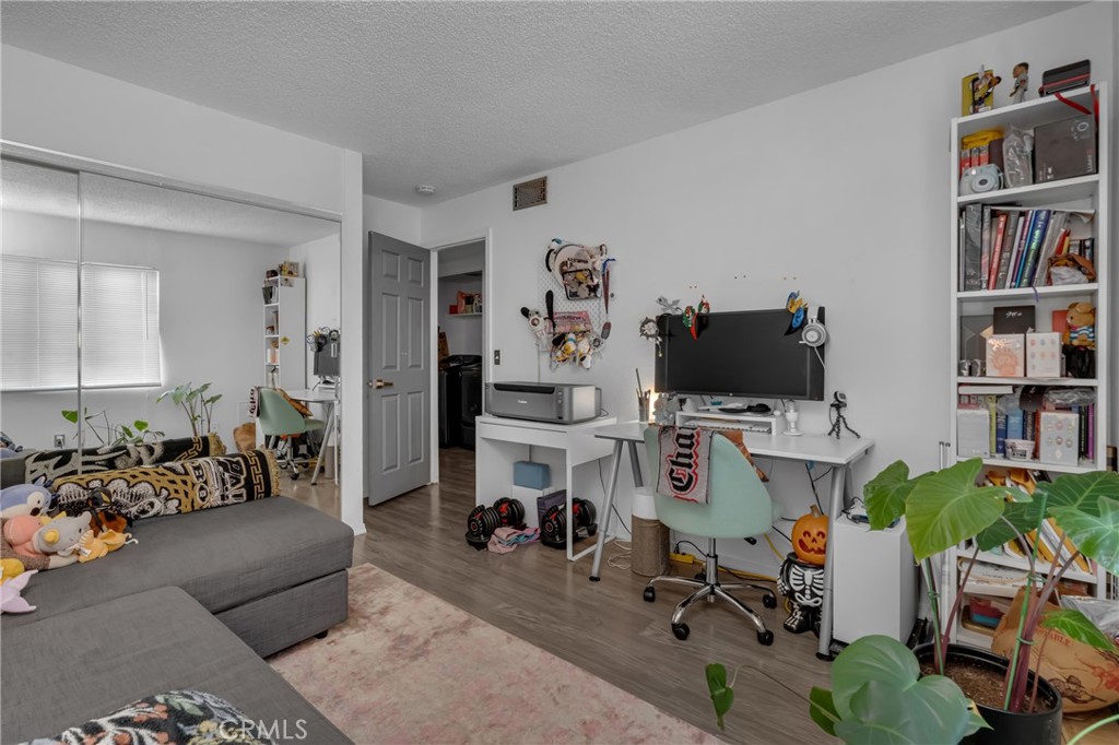 4424 San Jose Street, Unit 3 Montclair, CA 91763 - Photo 28 of 33 a living room with furniture and a flat screen tv