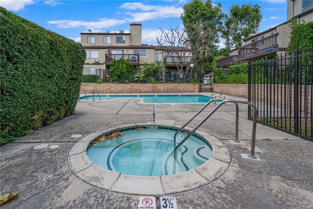 4424 San Jose Street, Unit 3 Montclair, CA 91763 - Photo 31 of 33 a view of a swimming pool with a patio