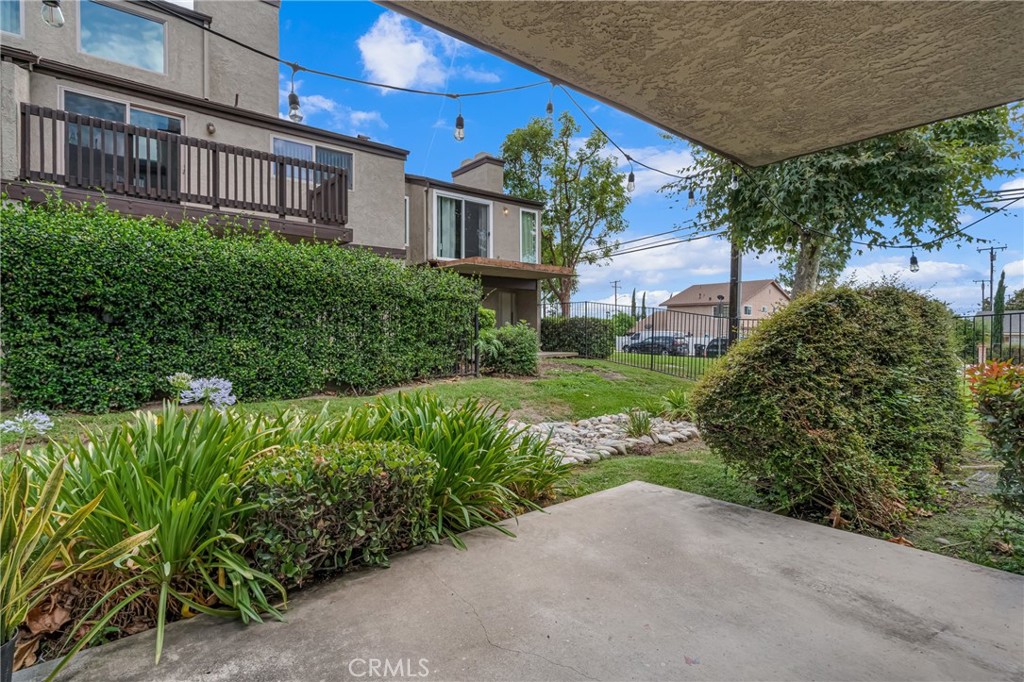 4424 San Jose Street, Unit 3 Montclair, CA 91763 - Photo 6 of 33 a view of a brick building next to a yard