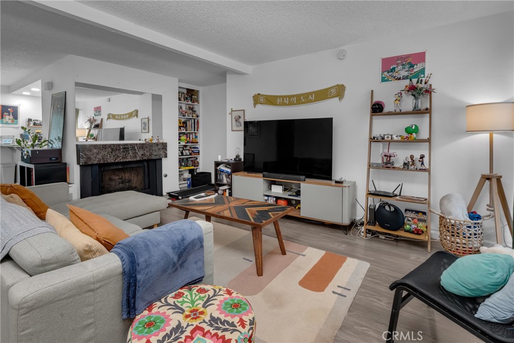 4424 San Jose Street, Unit 3 Montclair, CA 91763 - Photo 7 of 33 a living room with furniture and a flat screen tv