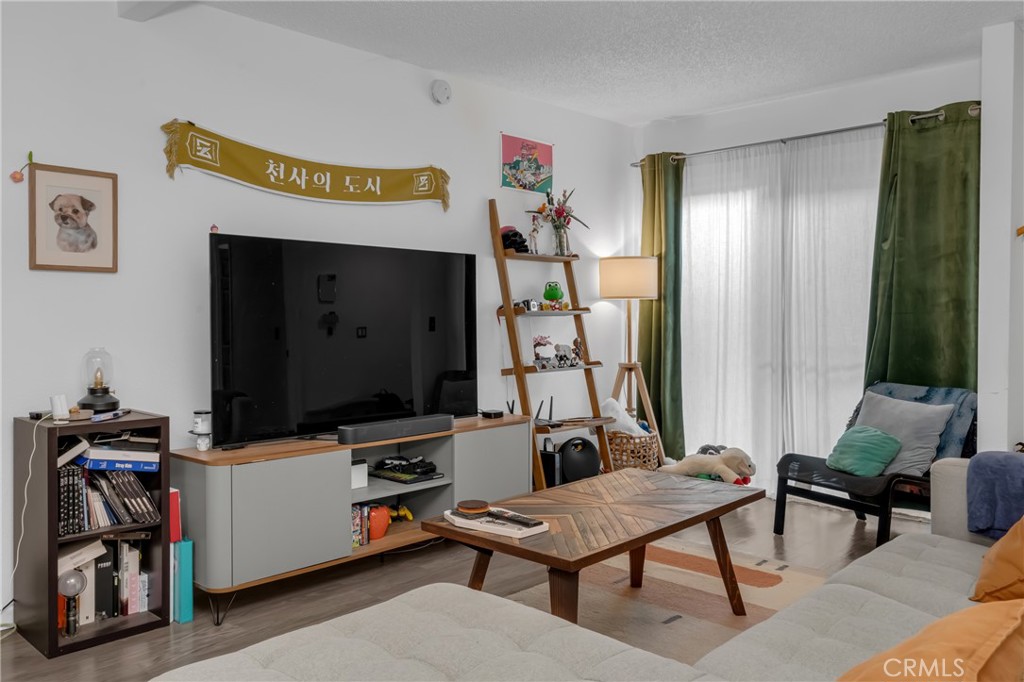 4424 San Jose Street, Unit 3 Montclair, CA 91763 - Photo 9 of 33 a living room with furniture and a flat screen tv