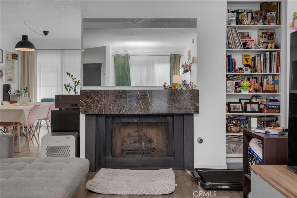 4424 San Jose Street, Unit 3 Montclair, CA 91763 - Photo 10 of 33 a living room with furniture and a fireplace