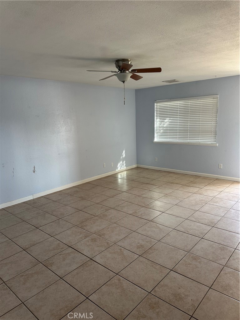 740 West Church Avenue Ridgecrest, CA 93555 - Photo 2 of 11 an empty room with windows