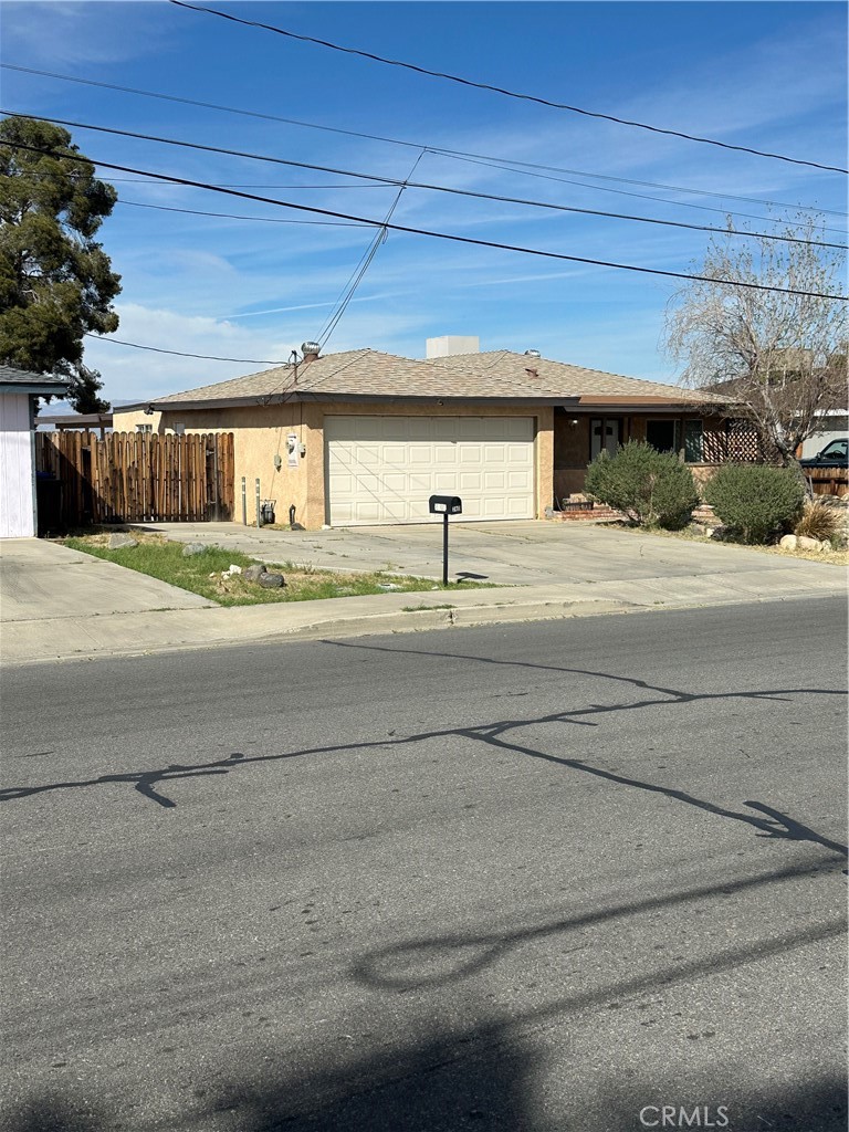 740 West Church Avenue Ridgecrest, CA 93555 - Photo 4 of 11 a house with a yard and outdoor space