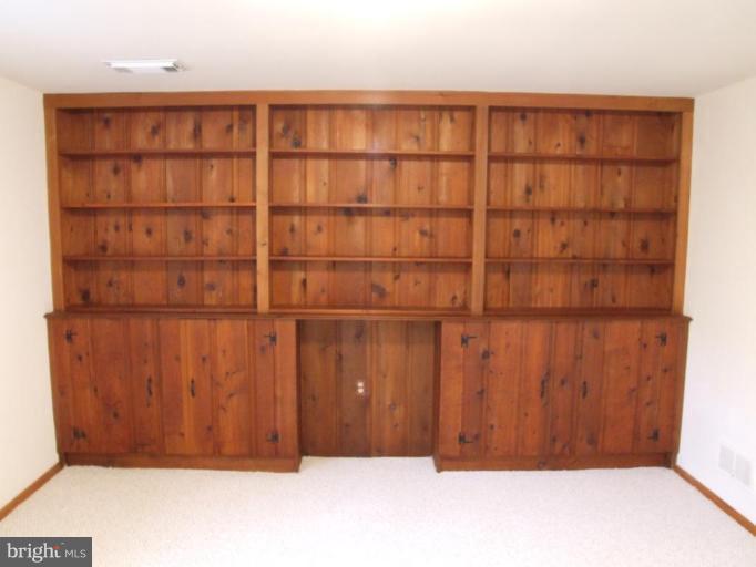 14211 Chesterfield Road Rockville, MD 20853 - Photo 14 of 28 Recreation Room with Bookshelves