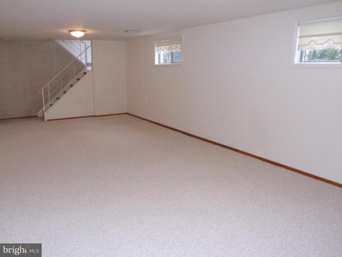 14211 Chesterfield Road Rockville, MD 20853 - Photo 17 of 28 Finished Recreation with New Carpet