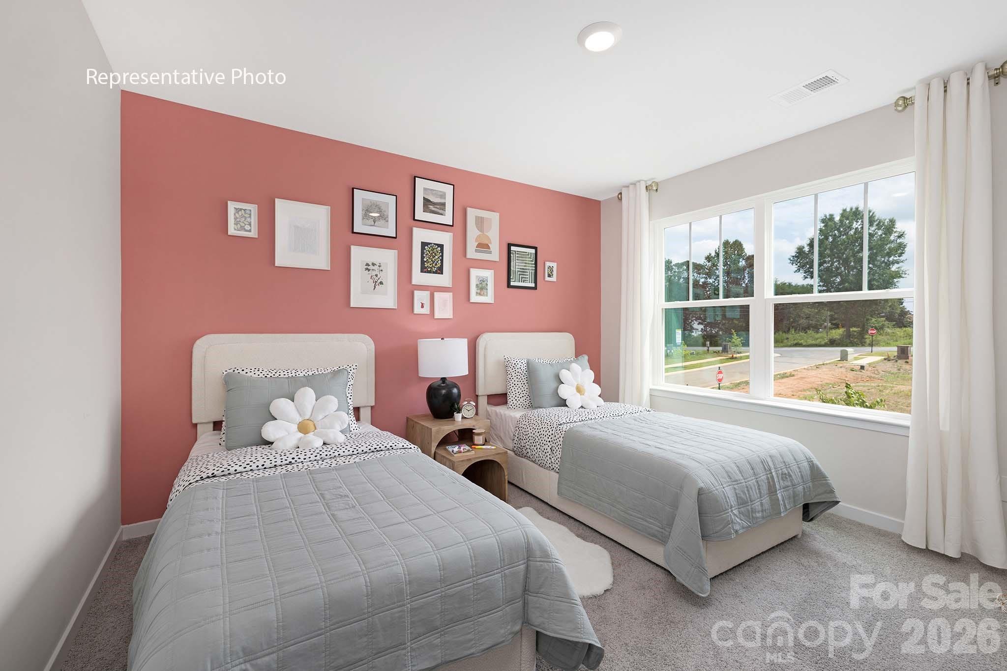 3036 Arundel Court Maiden, NC 28650 - Photo 13 of 22 a bedroom with two beds and a large window