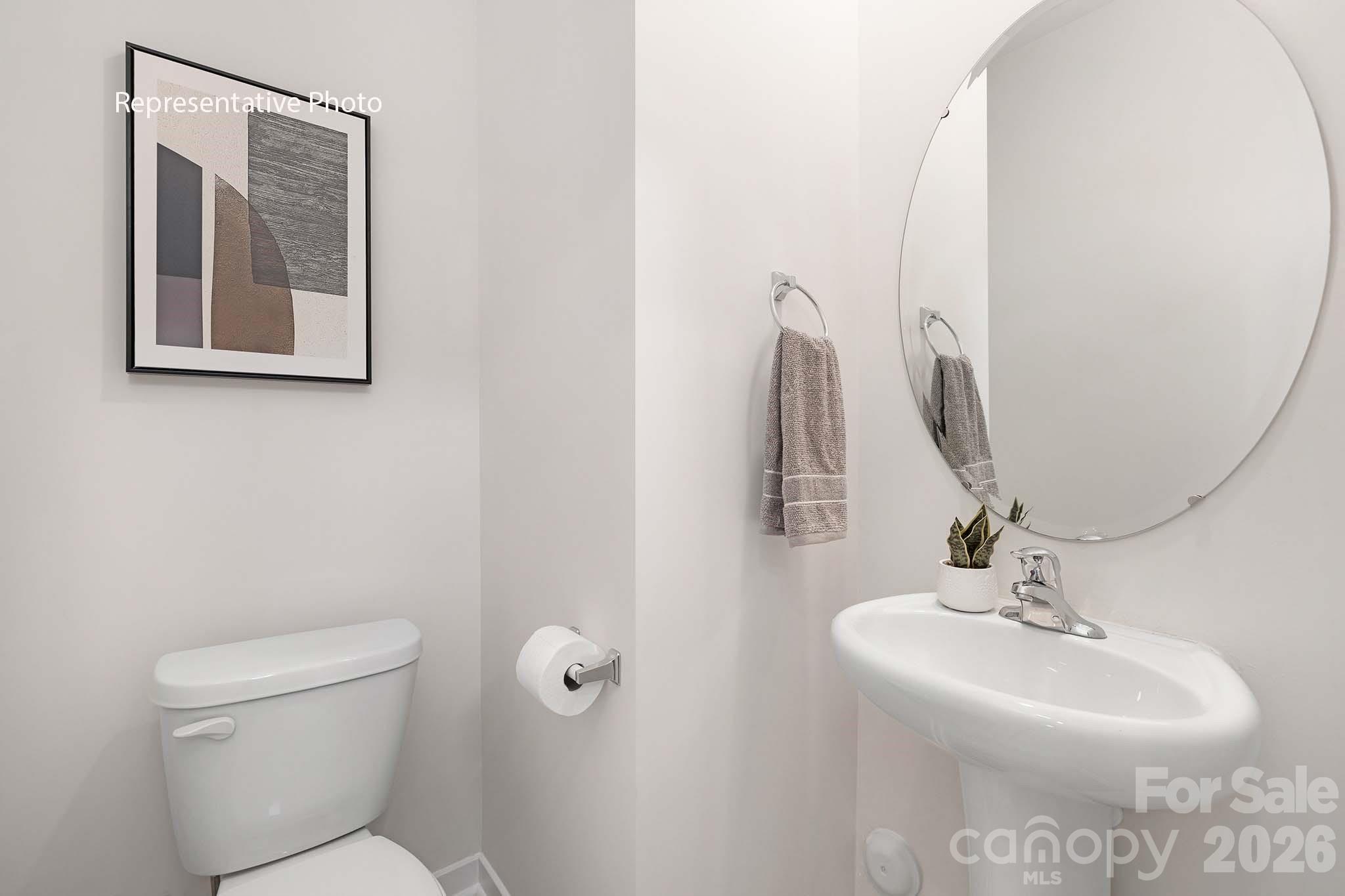 3036 Arundel Court Maiden, NC 28650 - Photo 20 of 22 a bathroom with a toilet sink and mirror