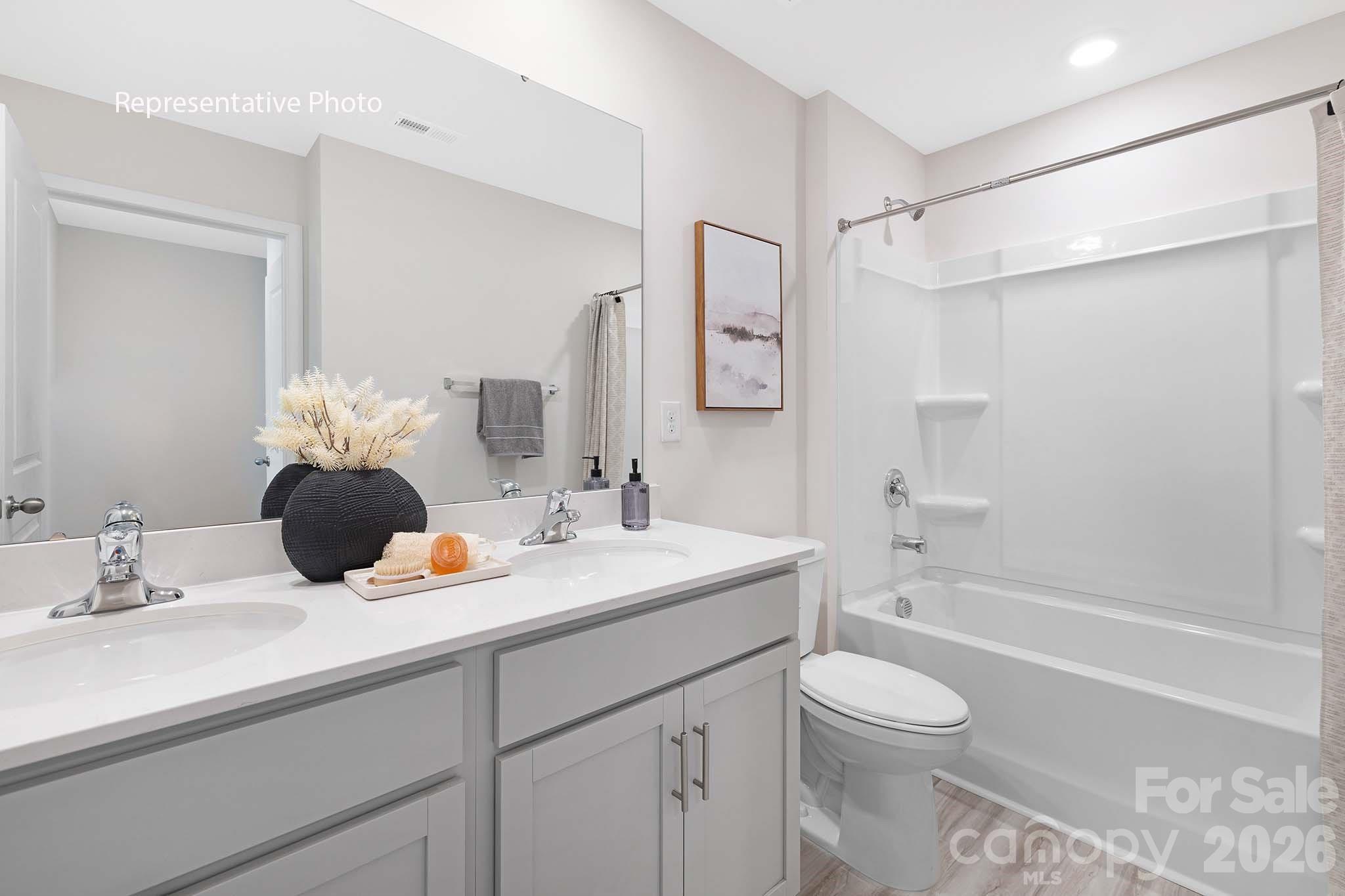 3036 Arundel Court Maiden, NC 28650 - Photo 22 of 22 a bathroom with a sink a toilet and shower