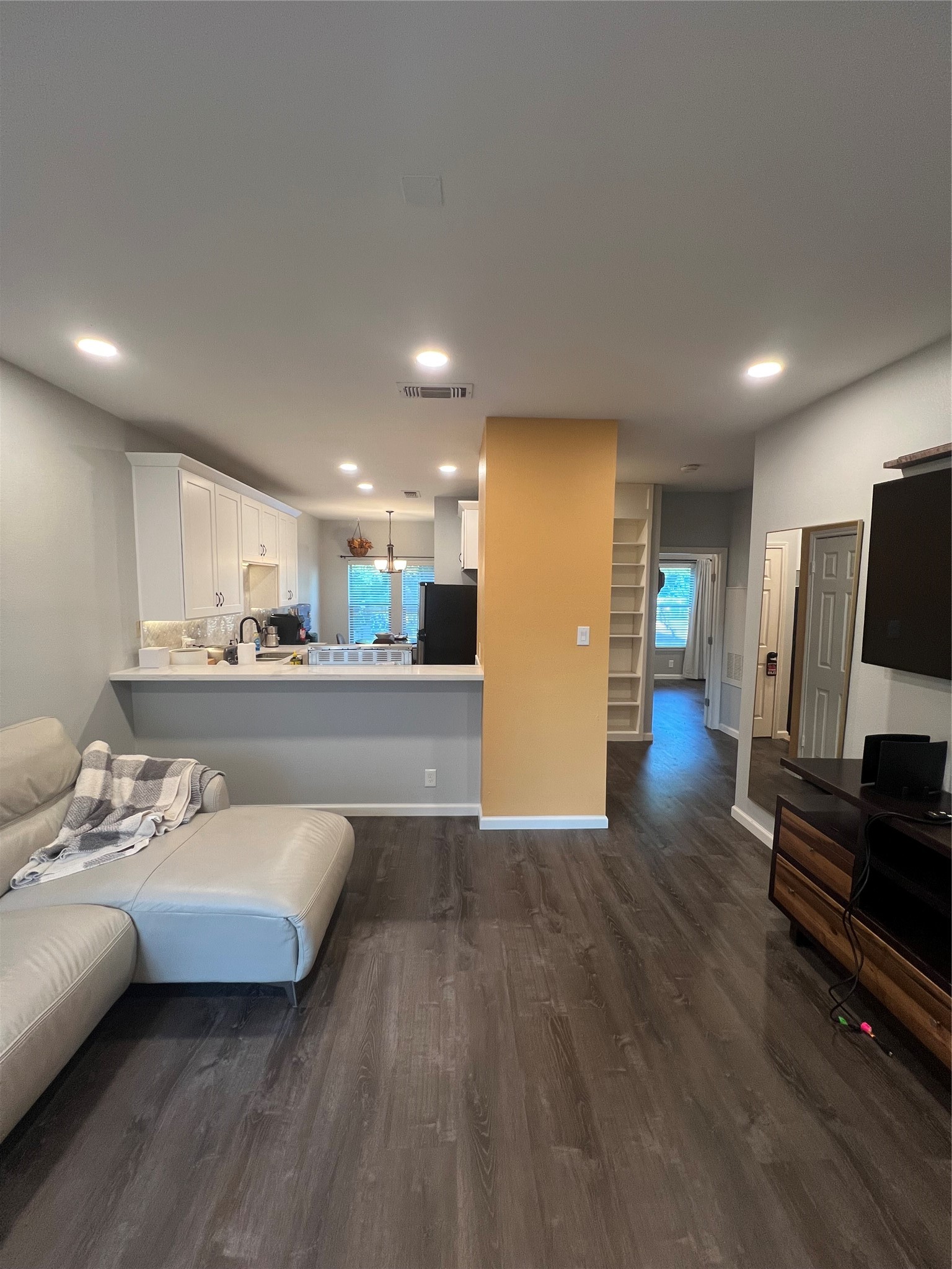 2414 Longview Street, Unit 202 Austin, TX 78705 - Photo 5 of 17 a living room with furniture and a flat screen tv