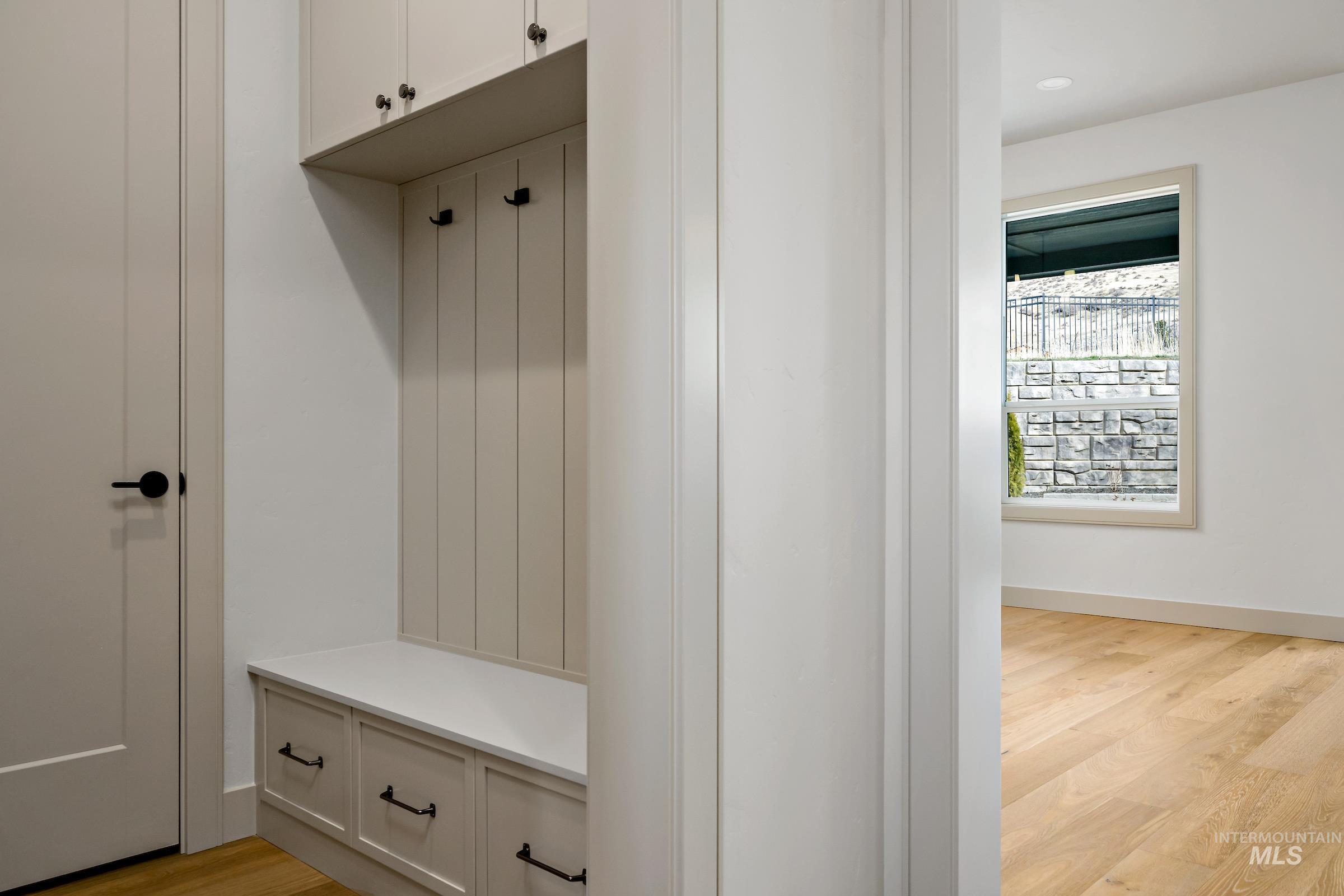 11696 North Rabbitbrush Way Boise, ID 83714 - Photo 19 of 32 Mudroom featuring light wood-style flooring and baseboards