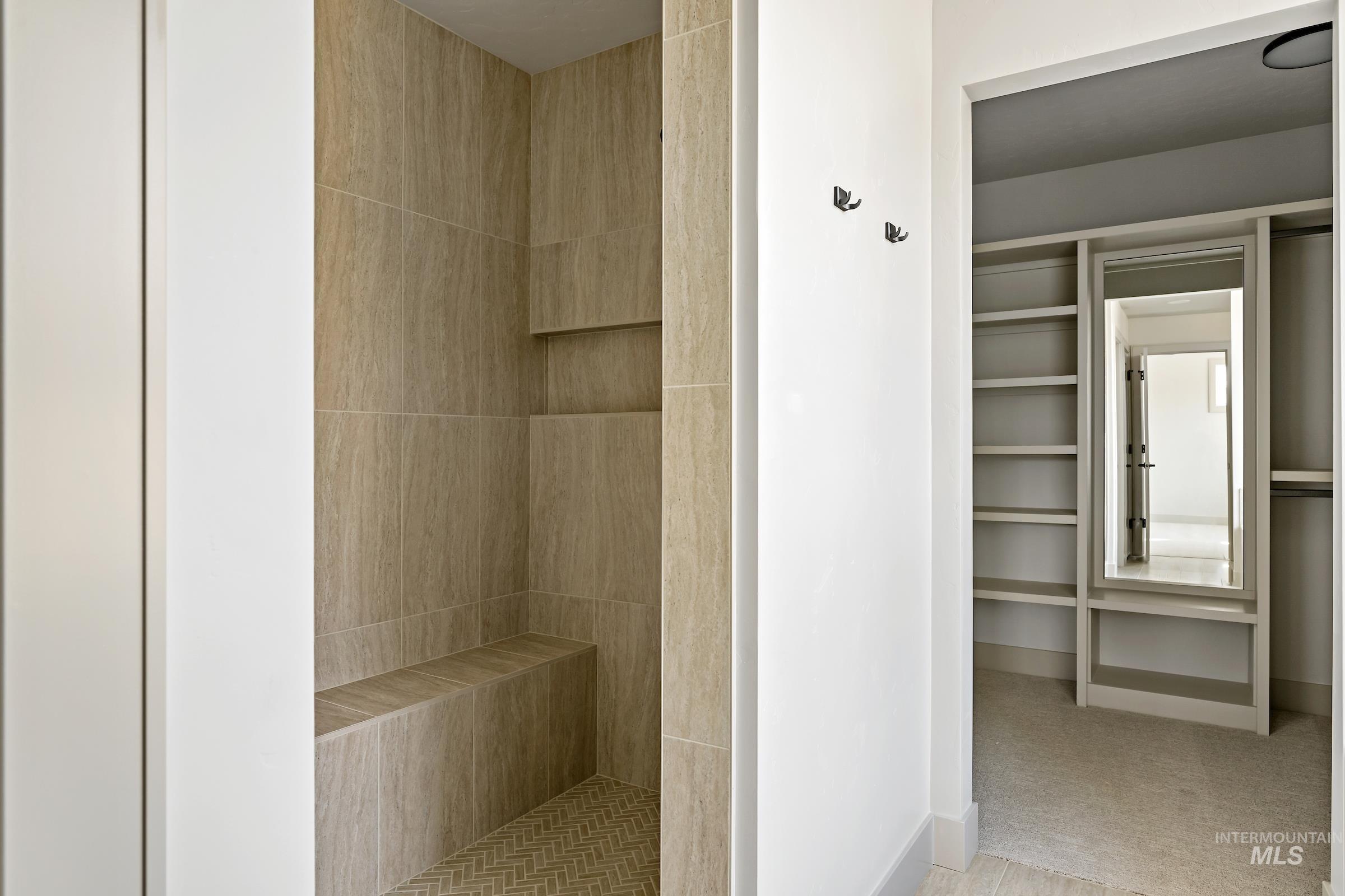 11696 North Rabbitbrush Way Boise, ID 83714 - Photo 25 of 32 Bathroom featuring a walk in closet and a tile shower