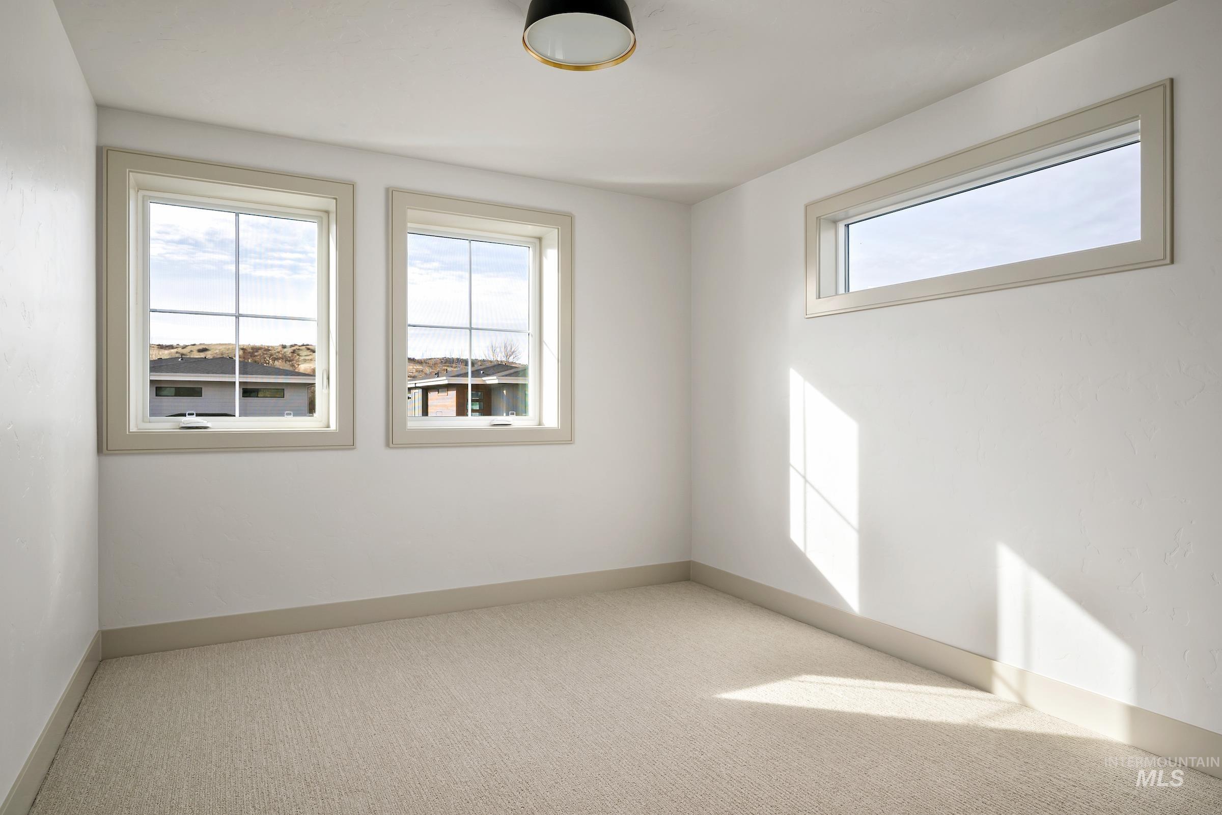 11696 North Rabbitbrush Way Boise, ID 83714 - Photo 29 of 32 Carpeted spare room with baseboards