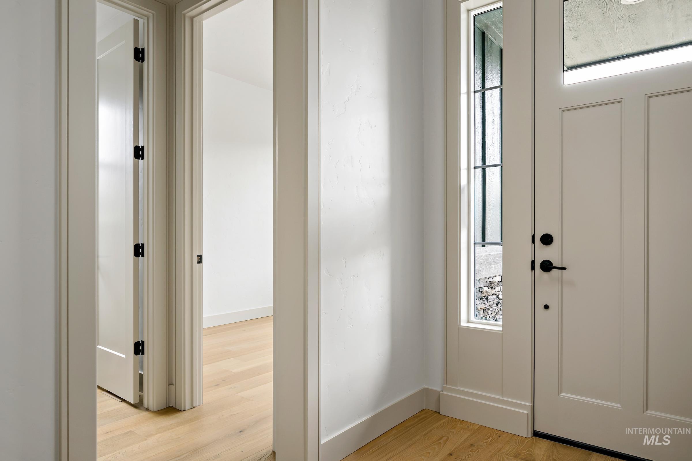 11696 North Rabbitbrush Way Boise, ID 83714 - Photo 4 of 32 Foyer entrance with healthy amount of natural light and light wood finished floors