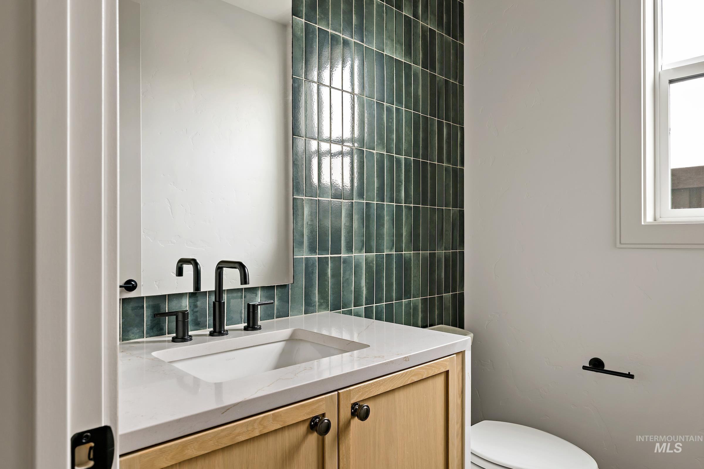 11696 North Rabbitbrush Way Boise, ID 83714 - Photo 5 of 32 Half bath featuring vanity and toilet