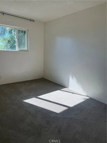 an empty room with a empty space and window