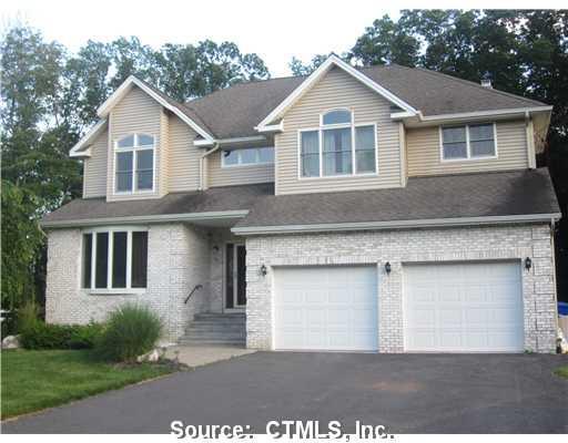 76 Abbe Road East Windsor, CT 06088 - Photo 1 of 1 a view of a yard in front of a house with plants