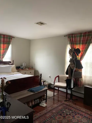 a room with furniture pool table and window