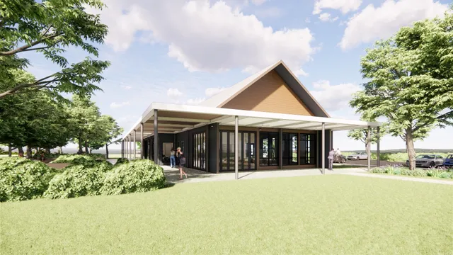 a view of house with yard and green space