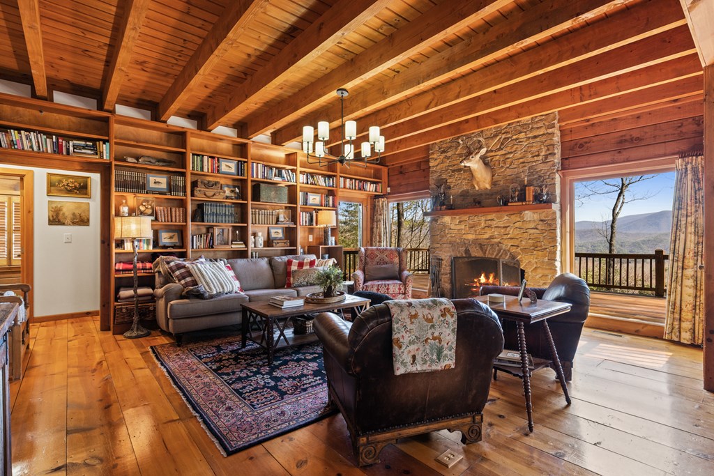 20 Broken Arrow Path Blue Ridge, GA 30513 - Photo 27 of 58 a living room with fireplace furniture and a wooden floor