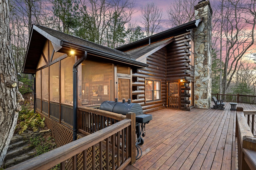 20 Broken Arrow Path Blue Ridge, GA 30513 - Photo 56 of 58 a view of a deck with wooden floor and barbeque oven