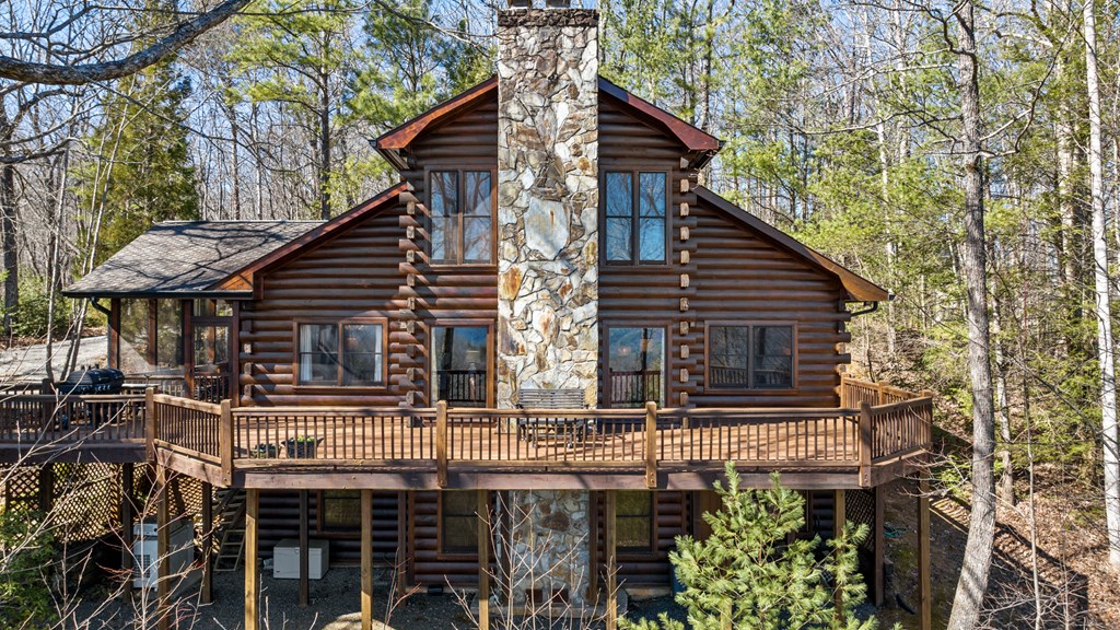 20 Broken Arrow Path Blue Ridge, GA 30513 - Photo 9 of 58 a view of house with a large window and potted plants
