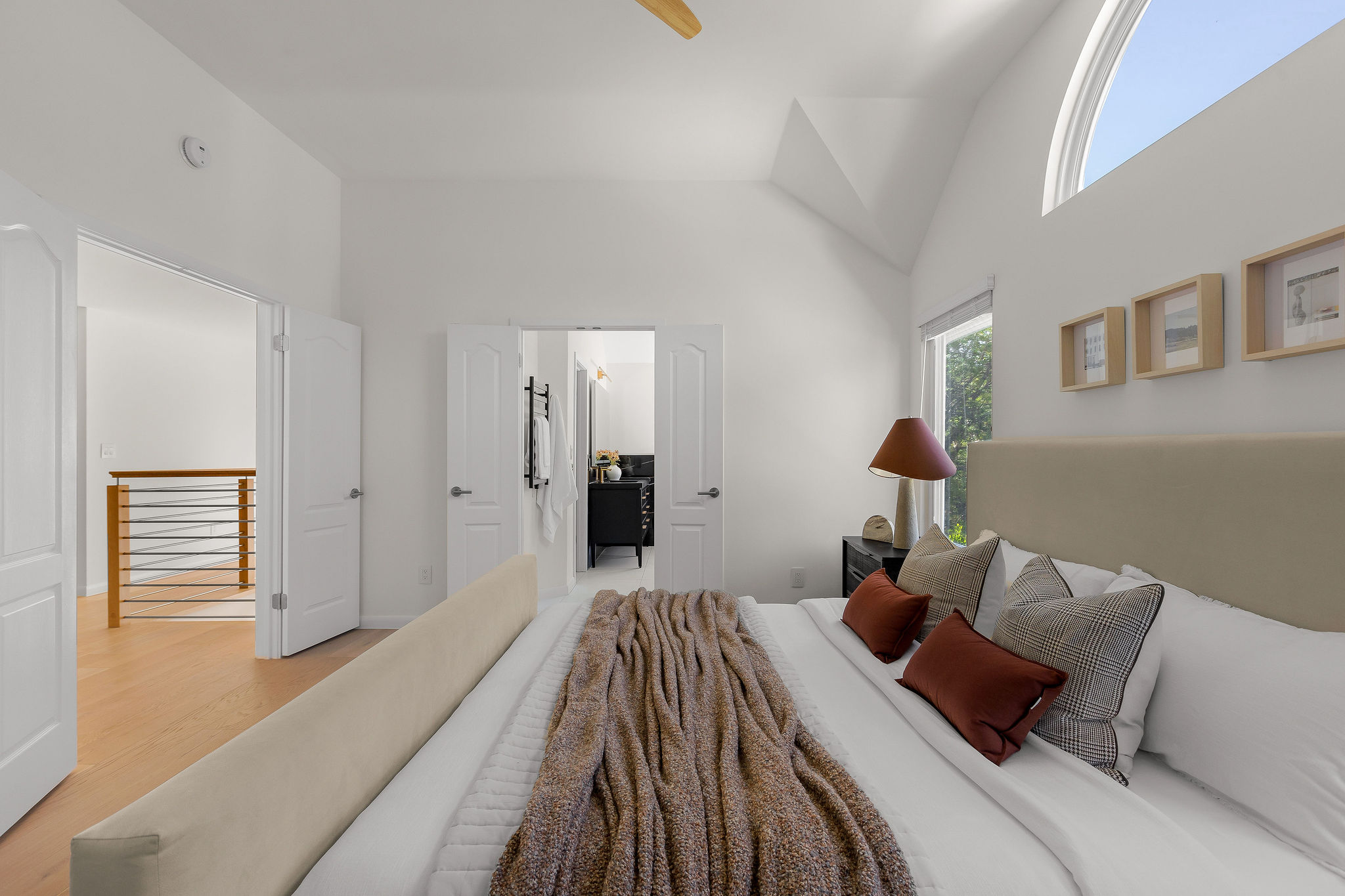 6500 Clay Allison Pass Austin, TX 78749 - Photo 23 of 39 Vaulted ceilings with an arched window and additional windows provide natural illumination