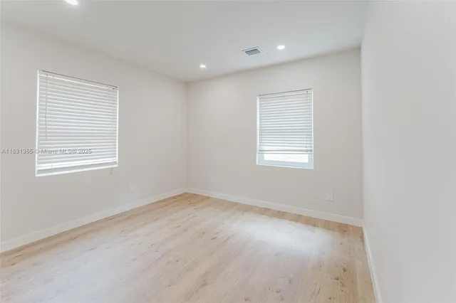 a view of kitchen with stainless steel appliances refrigerator microwave and stove