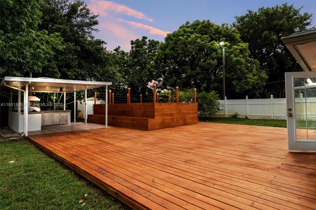 a view of pool with seating area