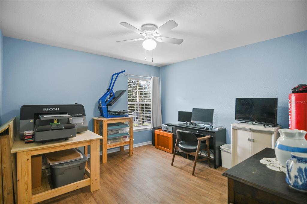 7417 Vista Way, Unit 202 Lakewood Ranch, FL 34202 - Photo 19 of 56 a view of a workspace with furniture and wooden floor