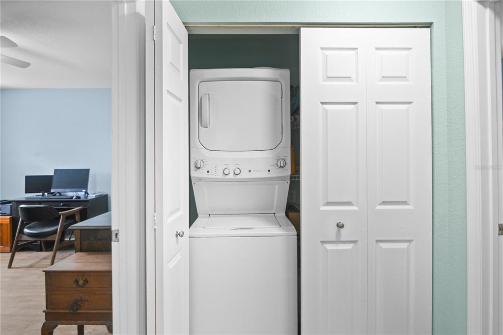 7417 Vista Way, Unit 202 Lakewood Ranch, FL 34202 - Photo 22 of 56 a utility room with dryer and washer