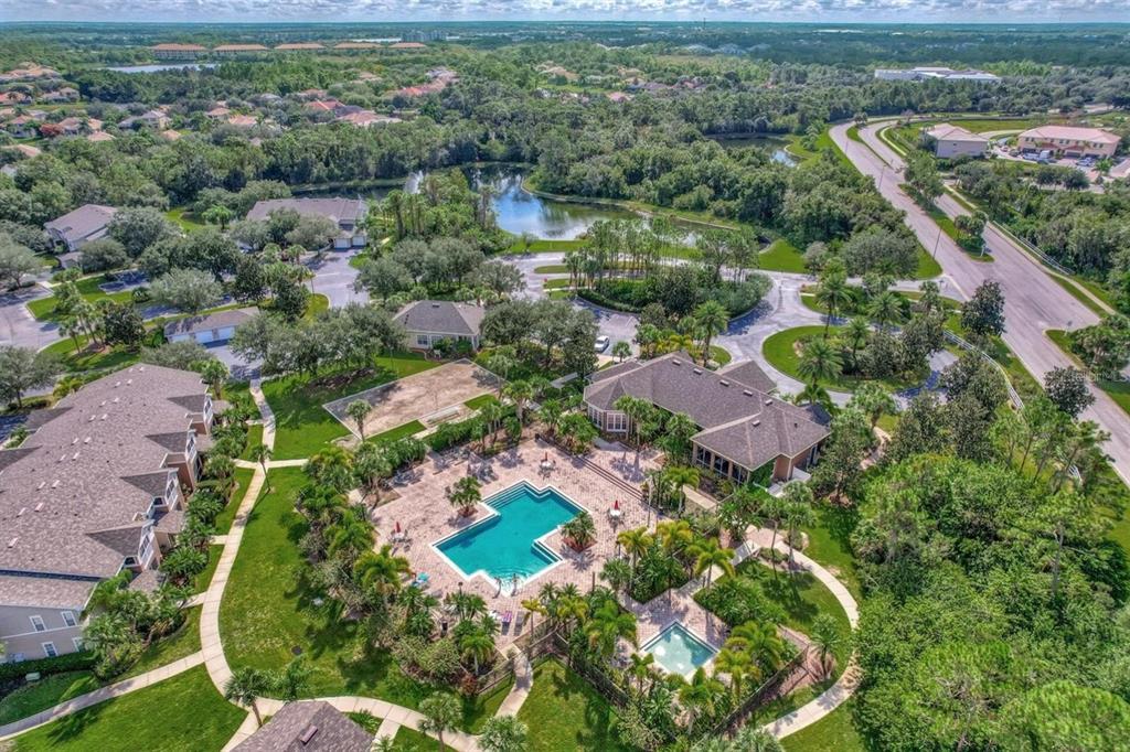 7417 Vista Way, Unit 202 Lakewood Ranch, FL 34202 - Photo 29 of 56 an aerial view of residential houses with outdoor space and city view