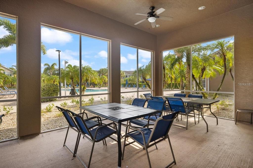 7417 Vista Way, Unit 202 Lakewood Ranch, FL 34202 - Photo 34 of 56 a view of a dining room with furniture window and outside view