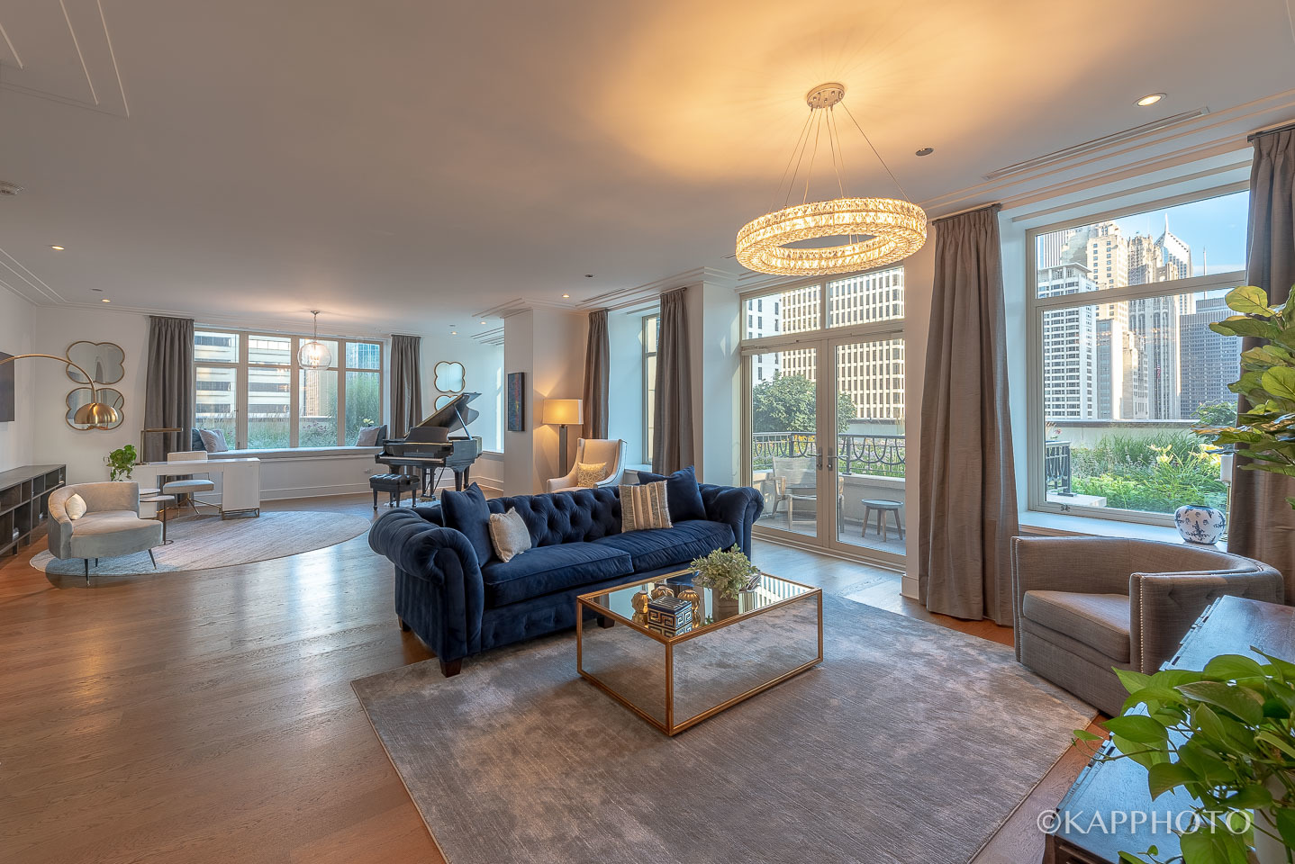 118 East Erie Street, Unit 15A Chicago, IL 60611 - Photo 6 of 28 a living room with furniture and a large window