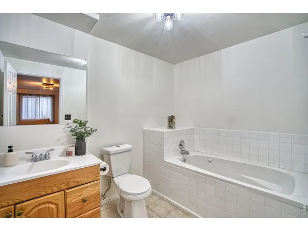 a living room with furniture and a piano