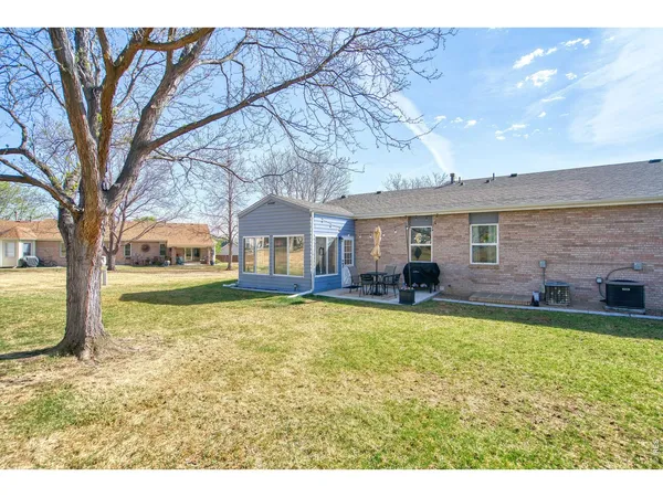 a house view with swimming pool in front of it