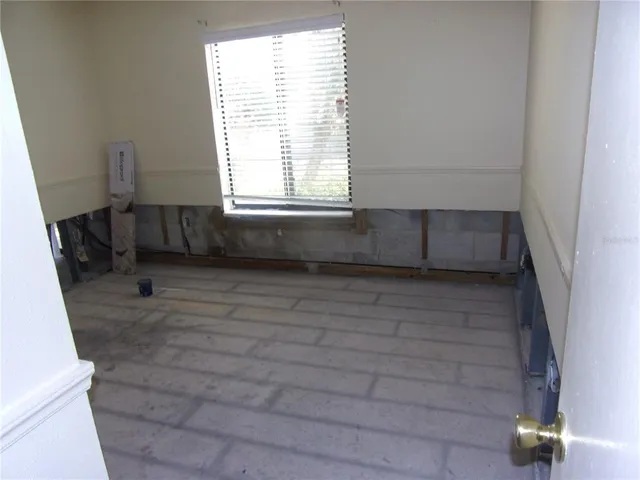 a view of hallway with wooden floor