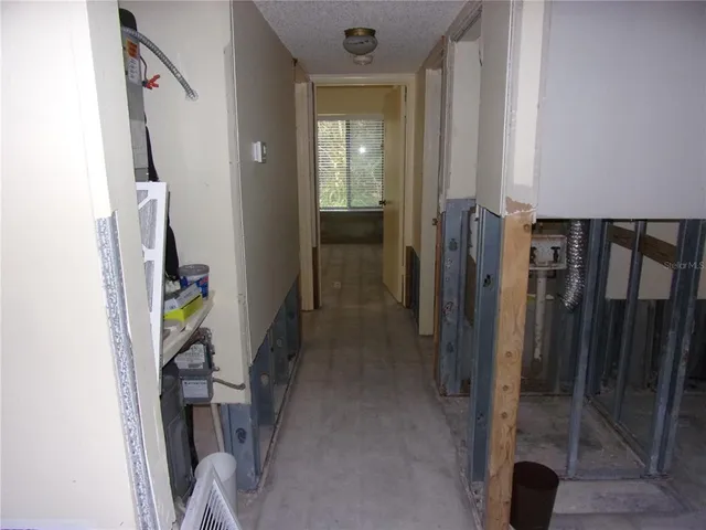 a swimming pool with outdoor seating and yard