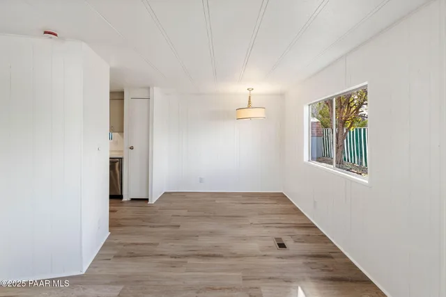 a view of an empty room and window