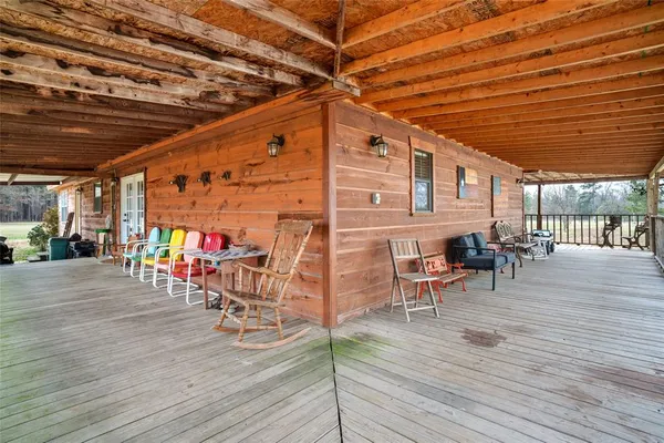 a view of a patio with table and chairs
